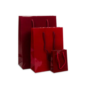 Donkerrode glanzende luxe tassen van papier