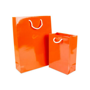 Oranje glanzende luxe tassen van papier